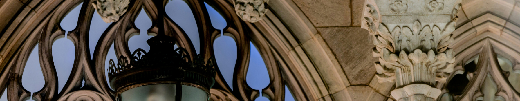 A Gothic lantern against stonework